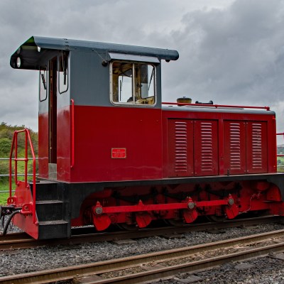 a train engine carrying carts down a track