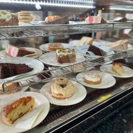 a glass display case filled with different types of food