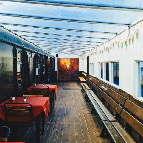 a group of people sitting at a train station