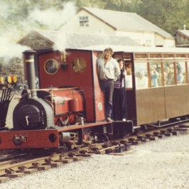 a train engine carrying carts down a track