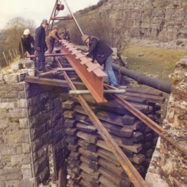 a person sitting on a rock