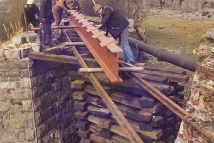a person sitting on a rock