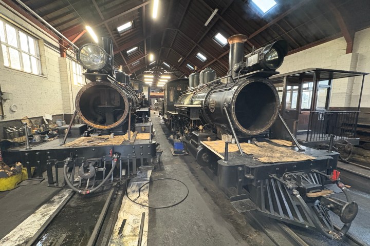 a group of people sitting at a train station