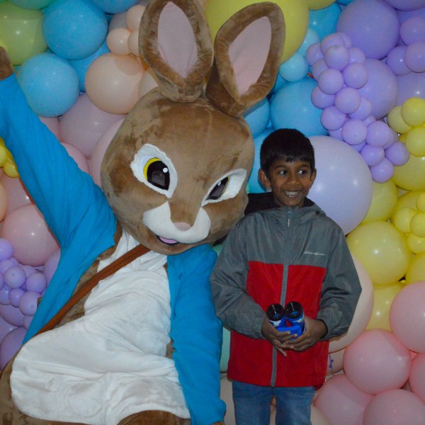 a group of teddy bears sitting on top of a pile of stuffed animals