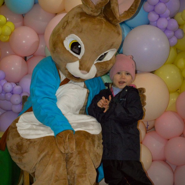 a group of teddy bears sitting on top of a pile of stuffed animals