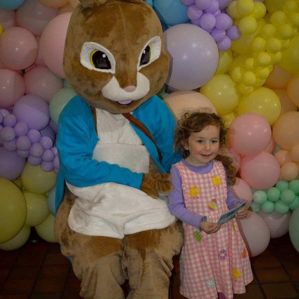 a group of teddy bears sitting on top of a pile of stuffed animals
