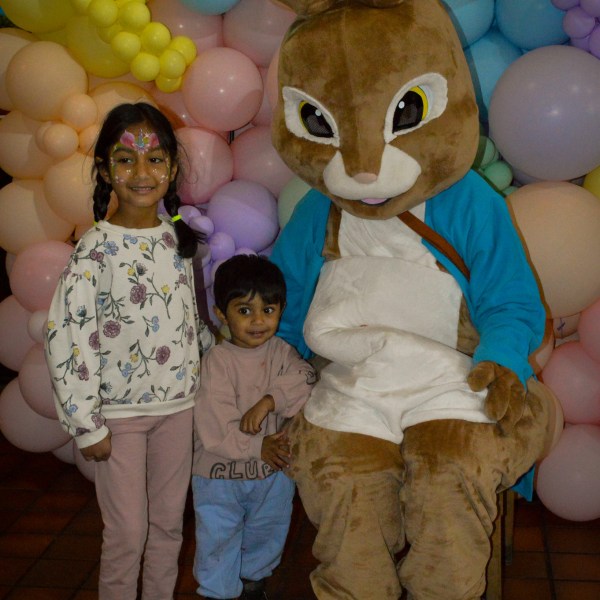 a group of teddy bears sitting on top of a pile of stuffed animals