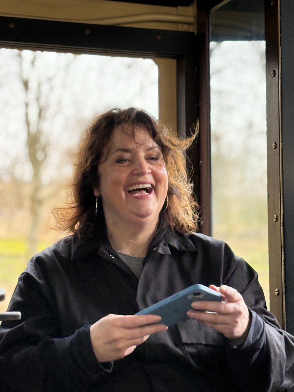 Ruth Jones holding a cell phone