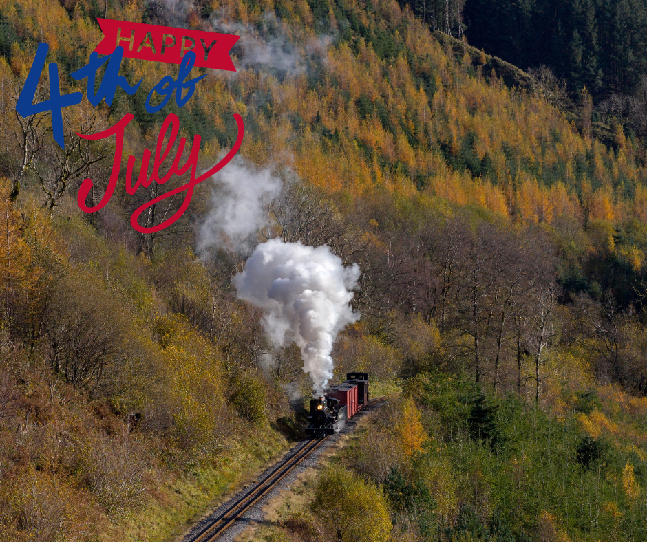 Steam train in forest with 'Happy 4th of July' text overlay in red and blue.